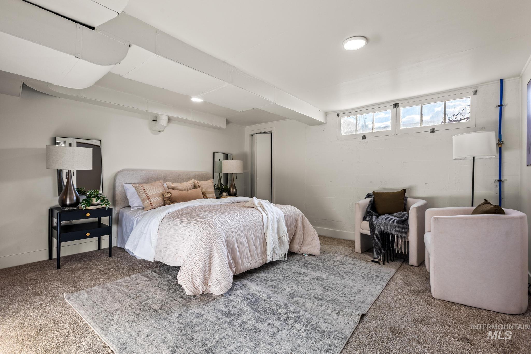 Bedroom featuring carpet flooring and a closet