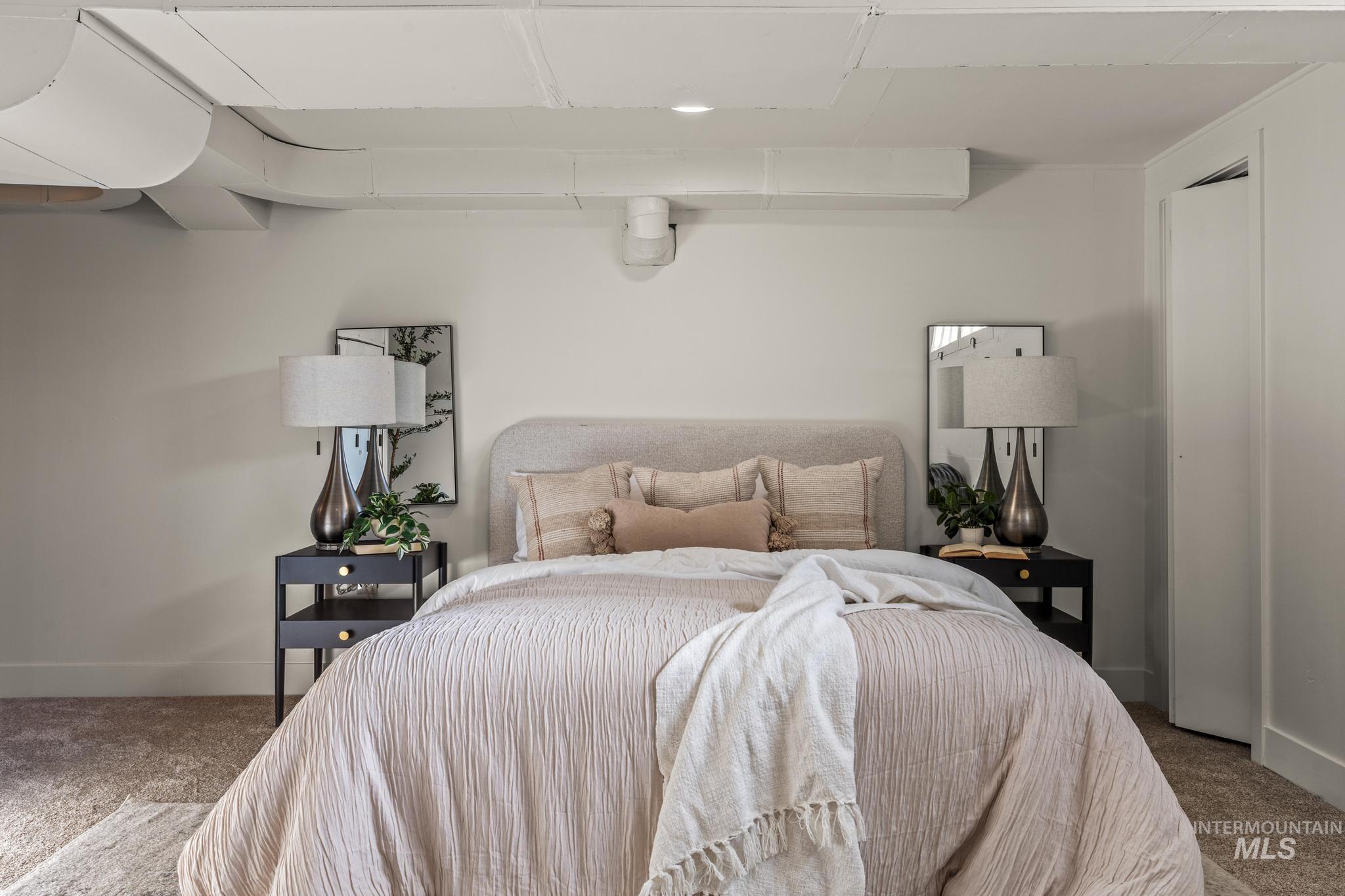 Carpeted bedroom with baseboards