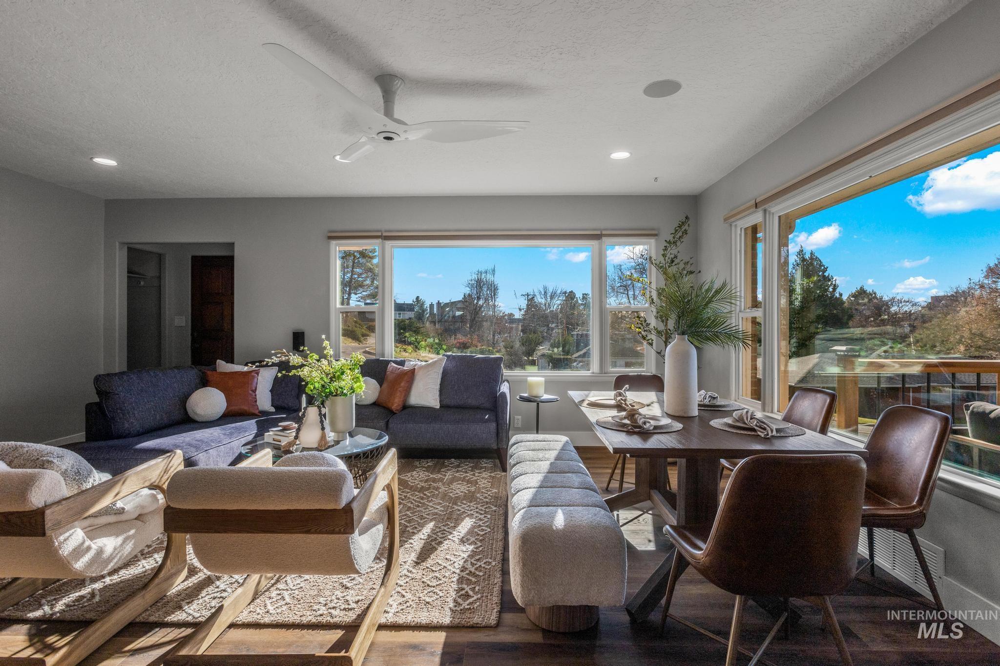 Living area featuring wood finished floors, ceiling fan, recessed lighting, and a textured ceiling
