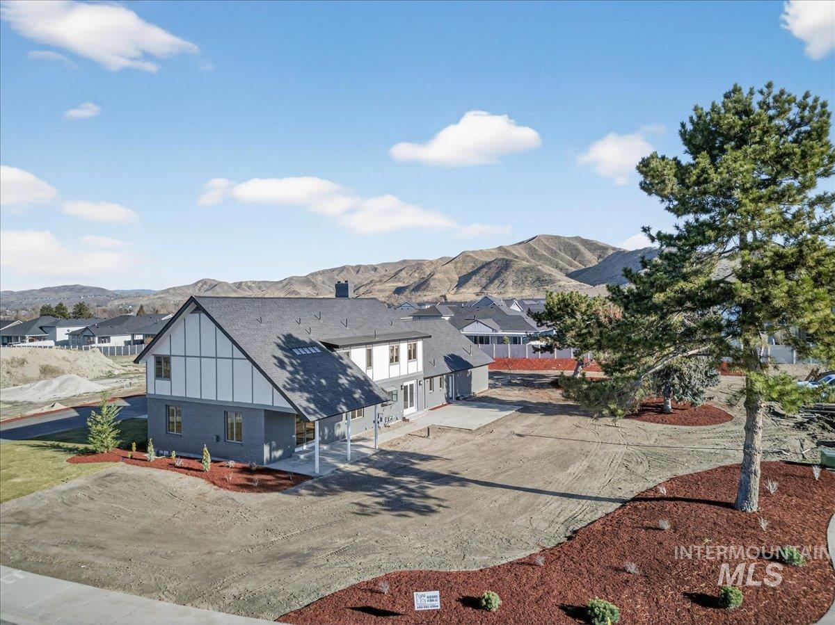 View of front facade featuring a mountain view and board and batten siding