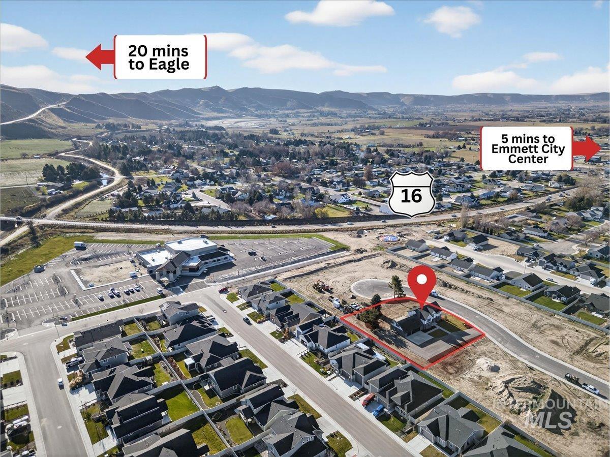 View of property location featuring a mountain backdrop and nearby suburban area