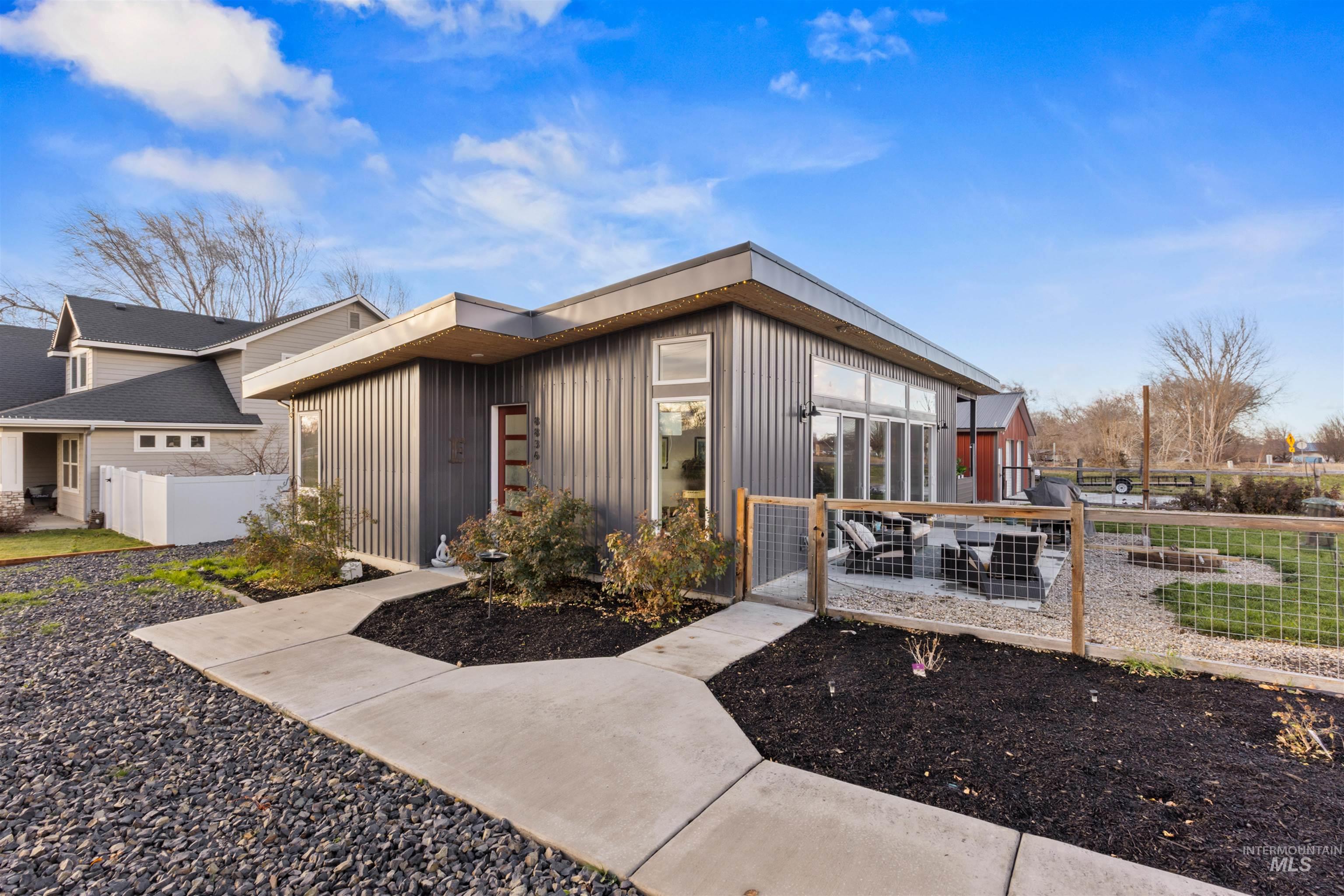 View of front facade with a fenced front yard