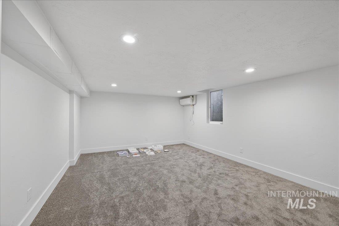 Finished below grade area with carpet floors and recessed lighting