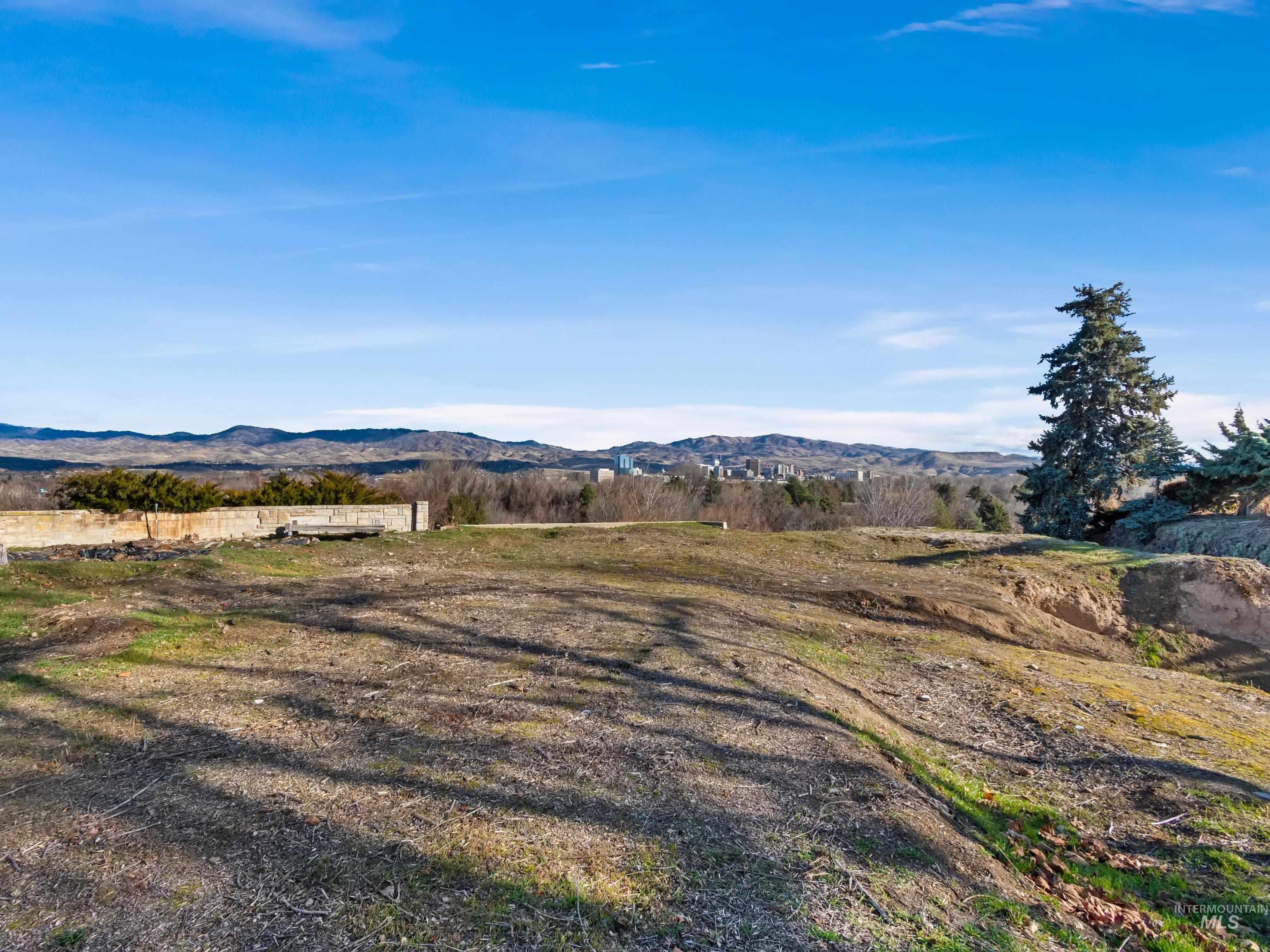 View of mountain backdrop with rural landscape