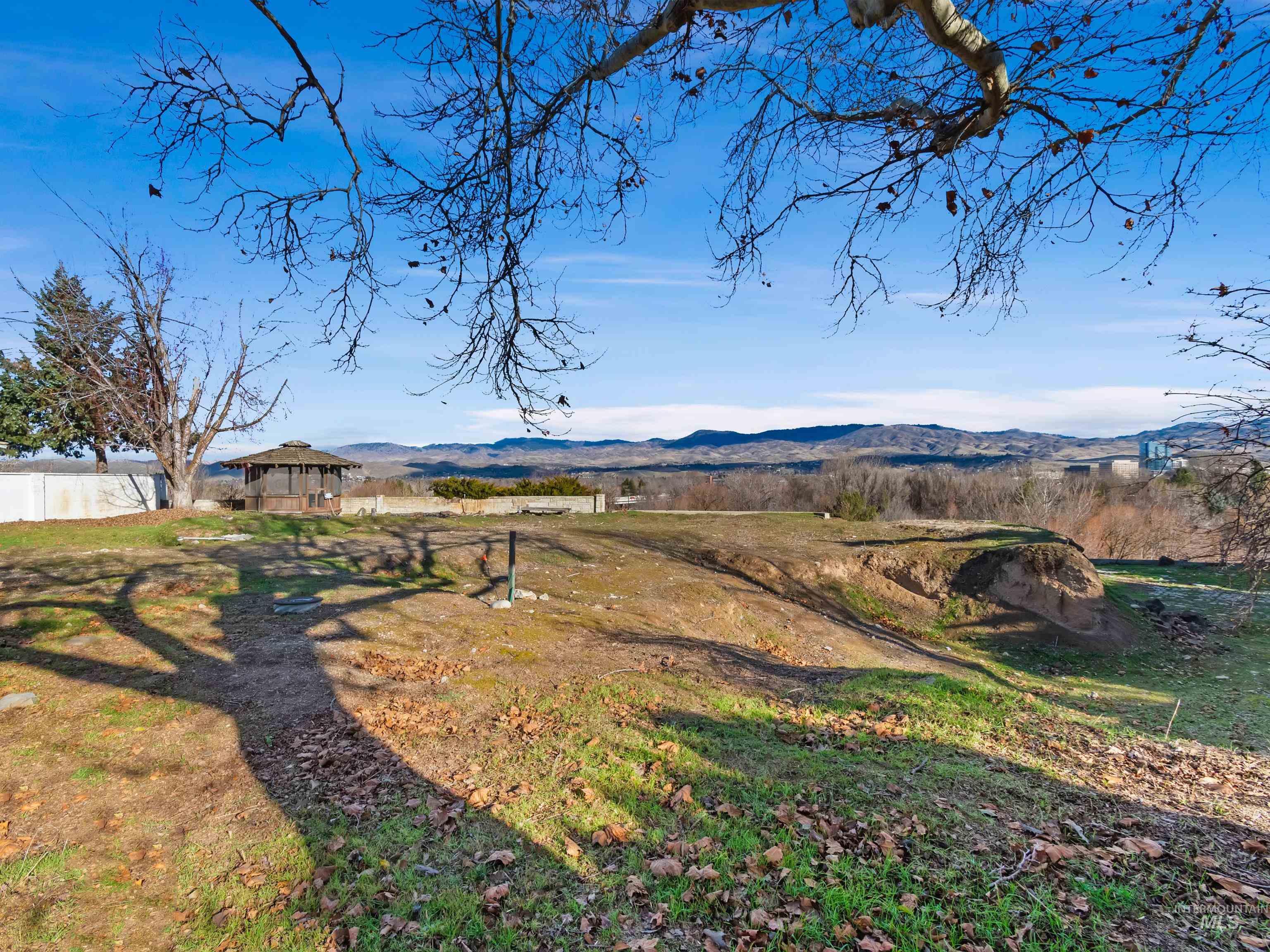 View of yard featuring a gazebo, a mountain view, and a view of countryside