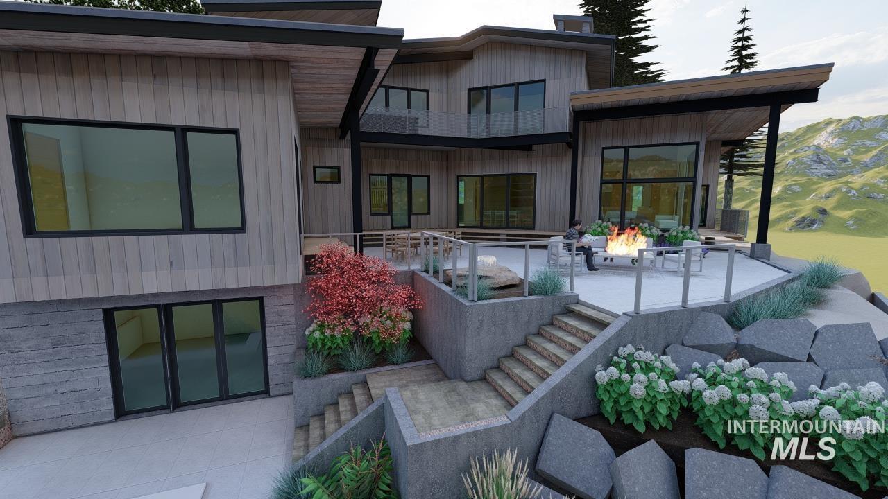 Rear view of house featuring a patio area, a fire pit, and stairs