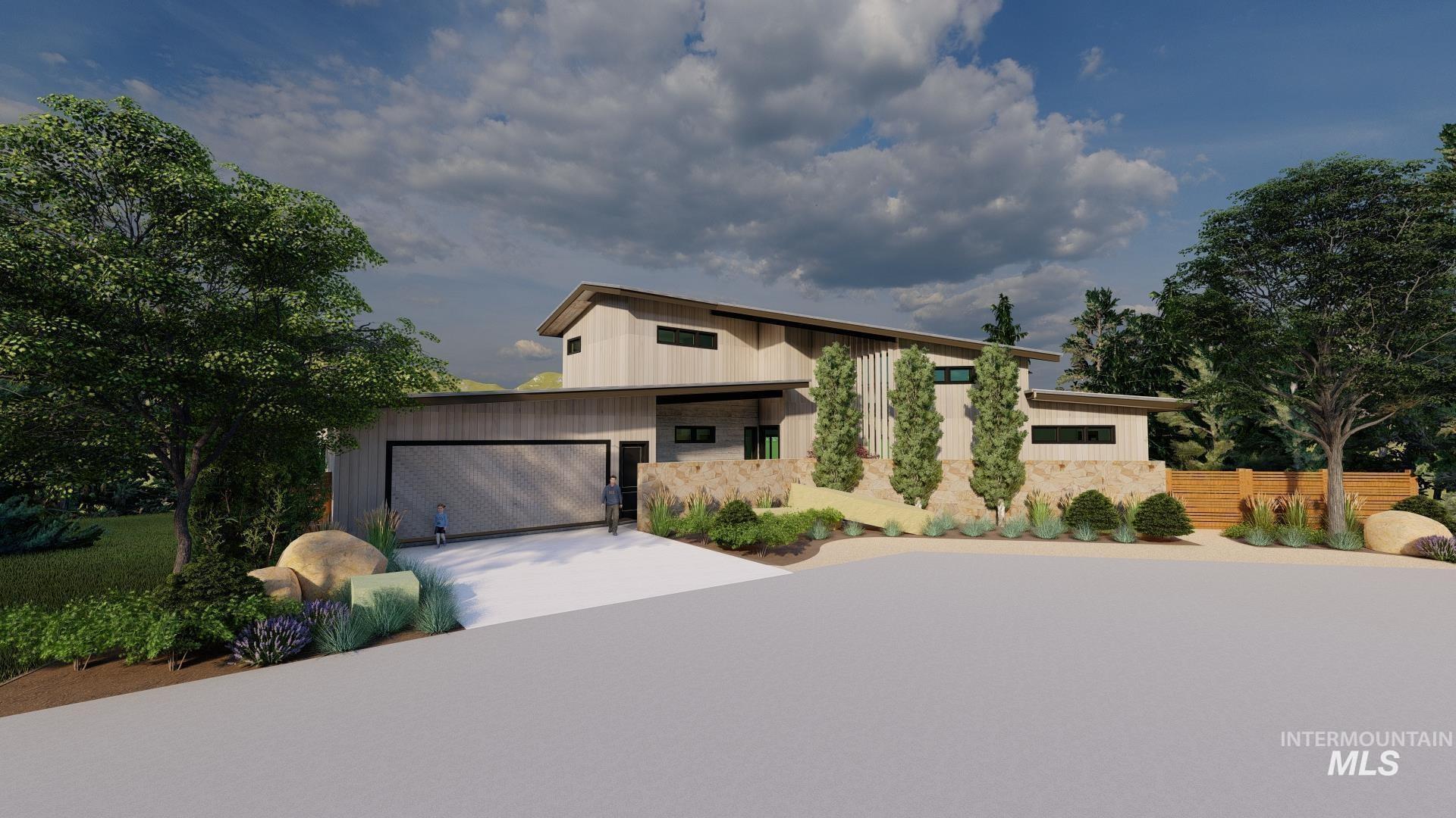 View of front facade featuring a garage, driveway, and stone siding