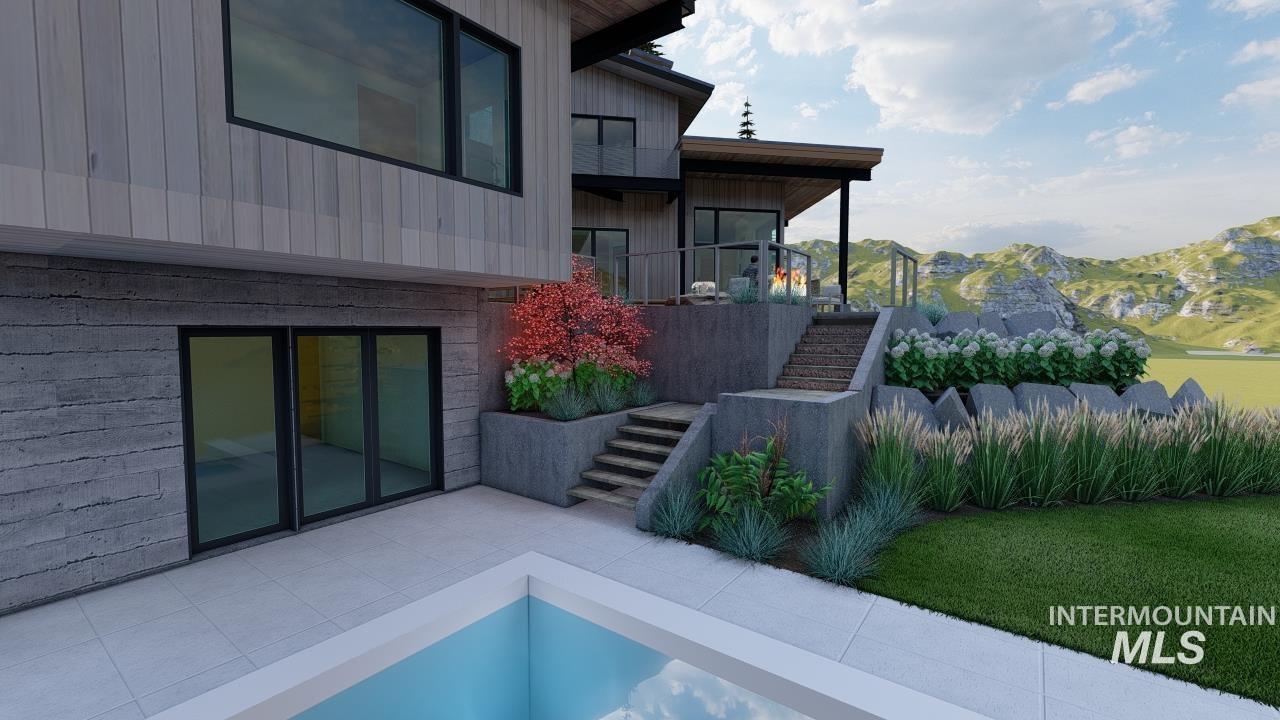 View of property exterior featuring stairs, a balcony, a mountain view, and board and batten siding