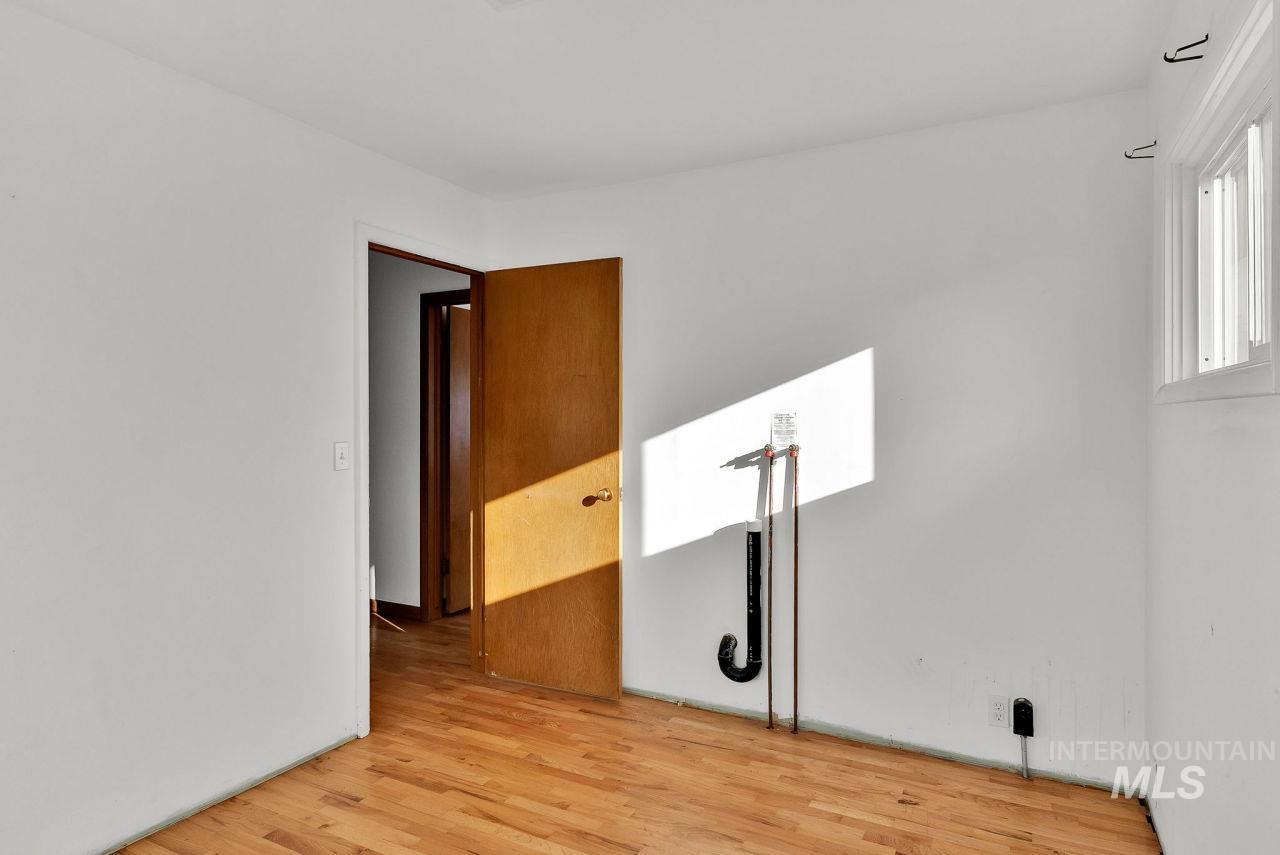 Spare room featuring light wood-style floors
