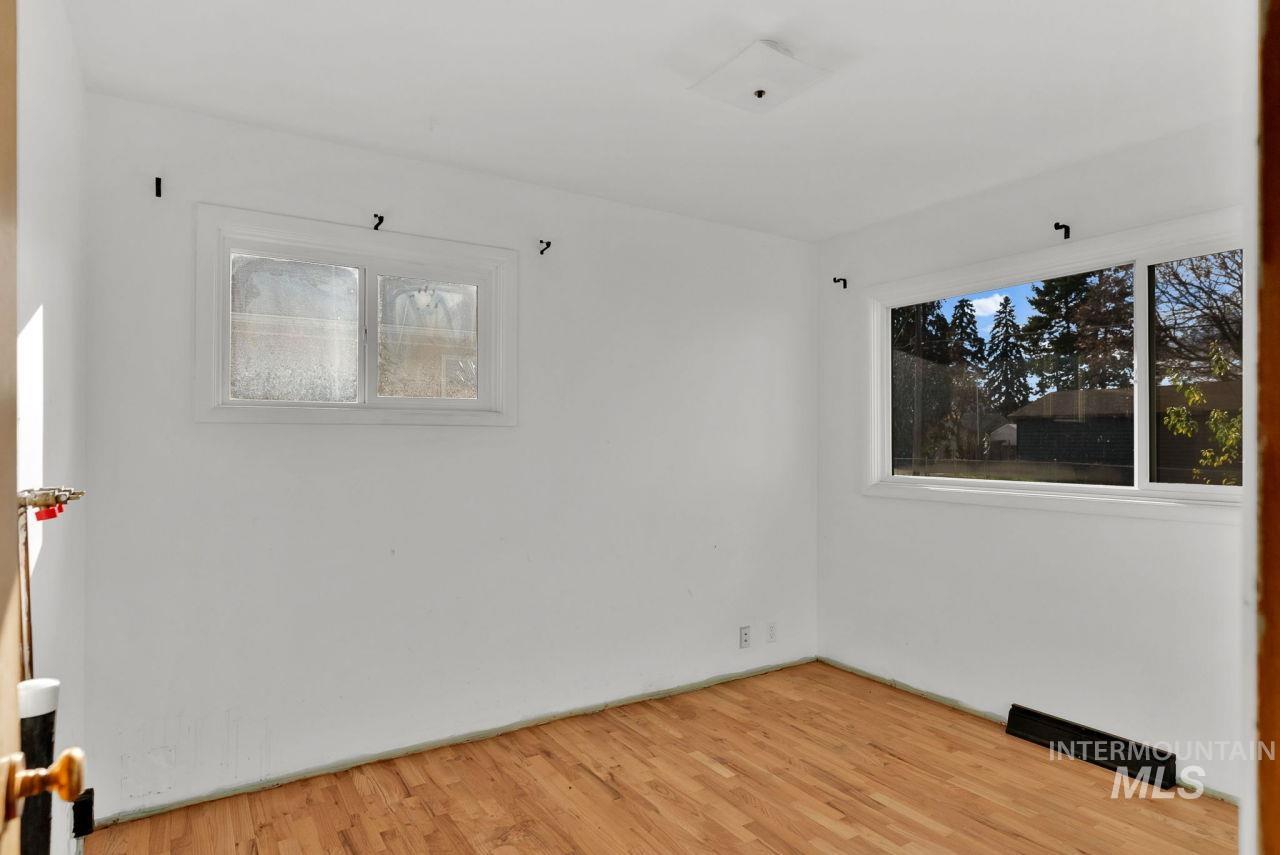 Unfurnished room featuring light wood finished floors