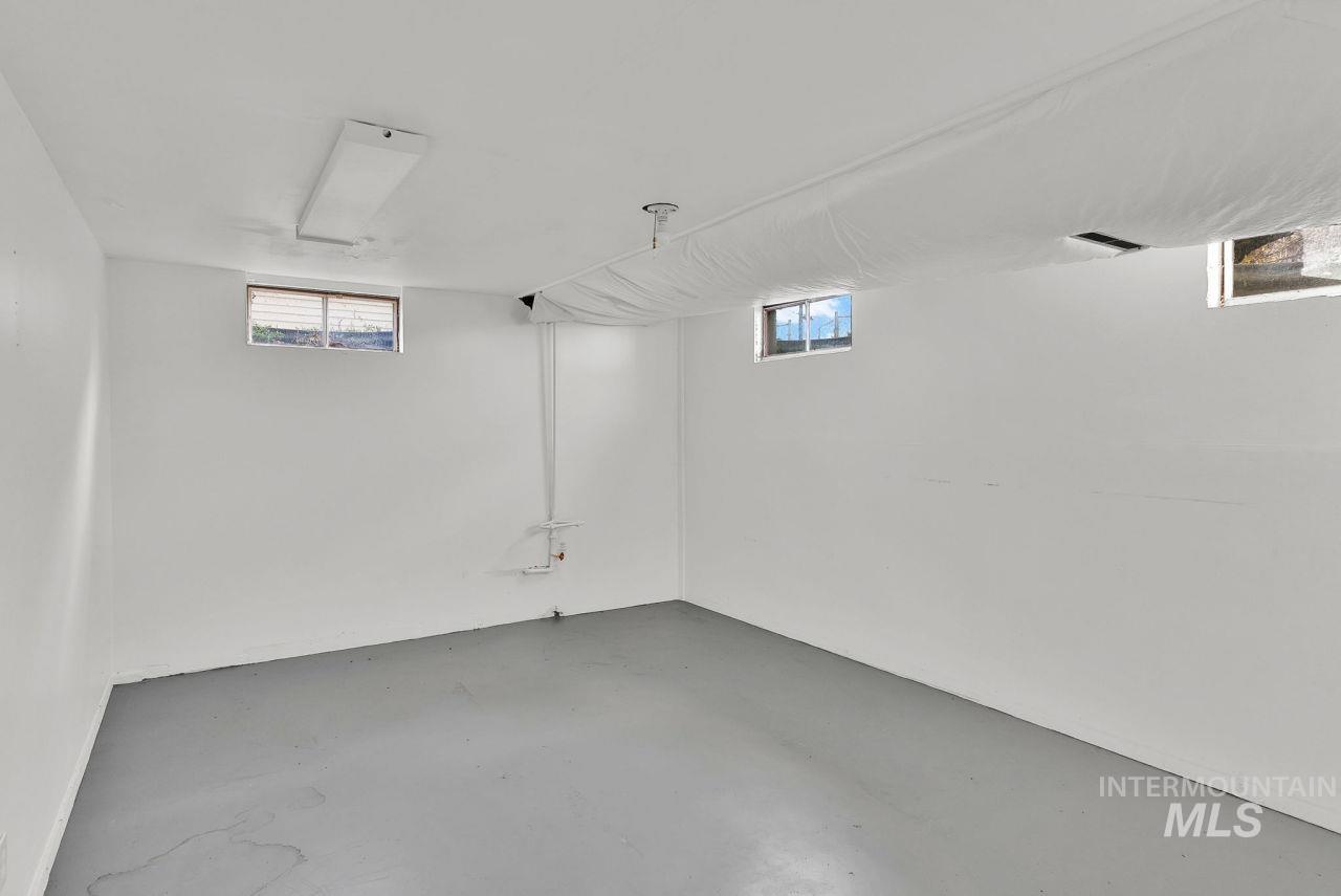 Basement featuring plenty of natural light
