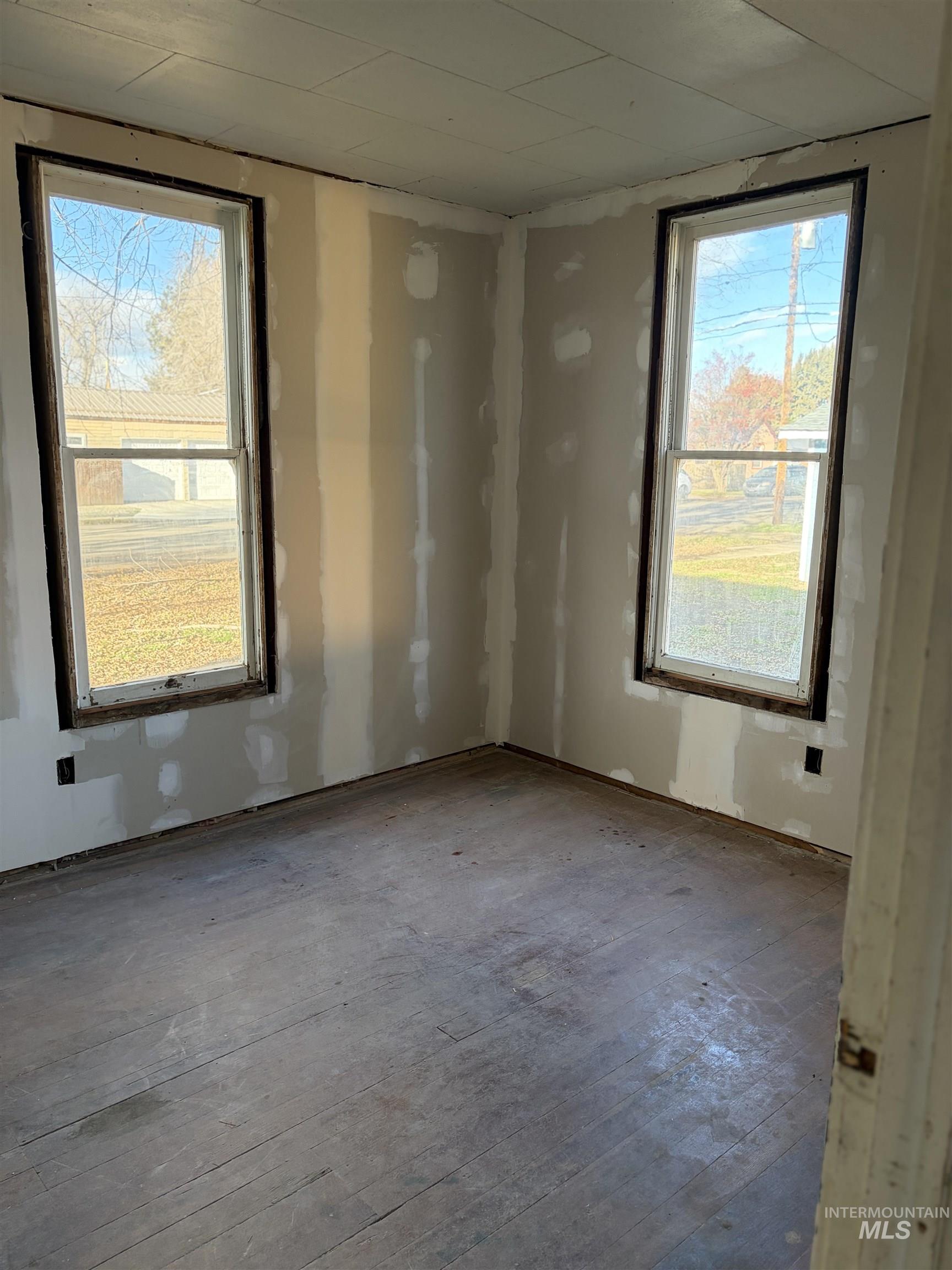 Unfurnished room with plenty of natural light