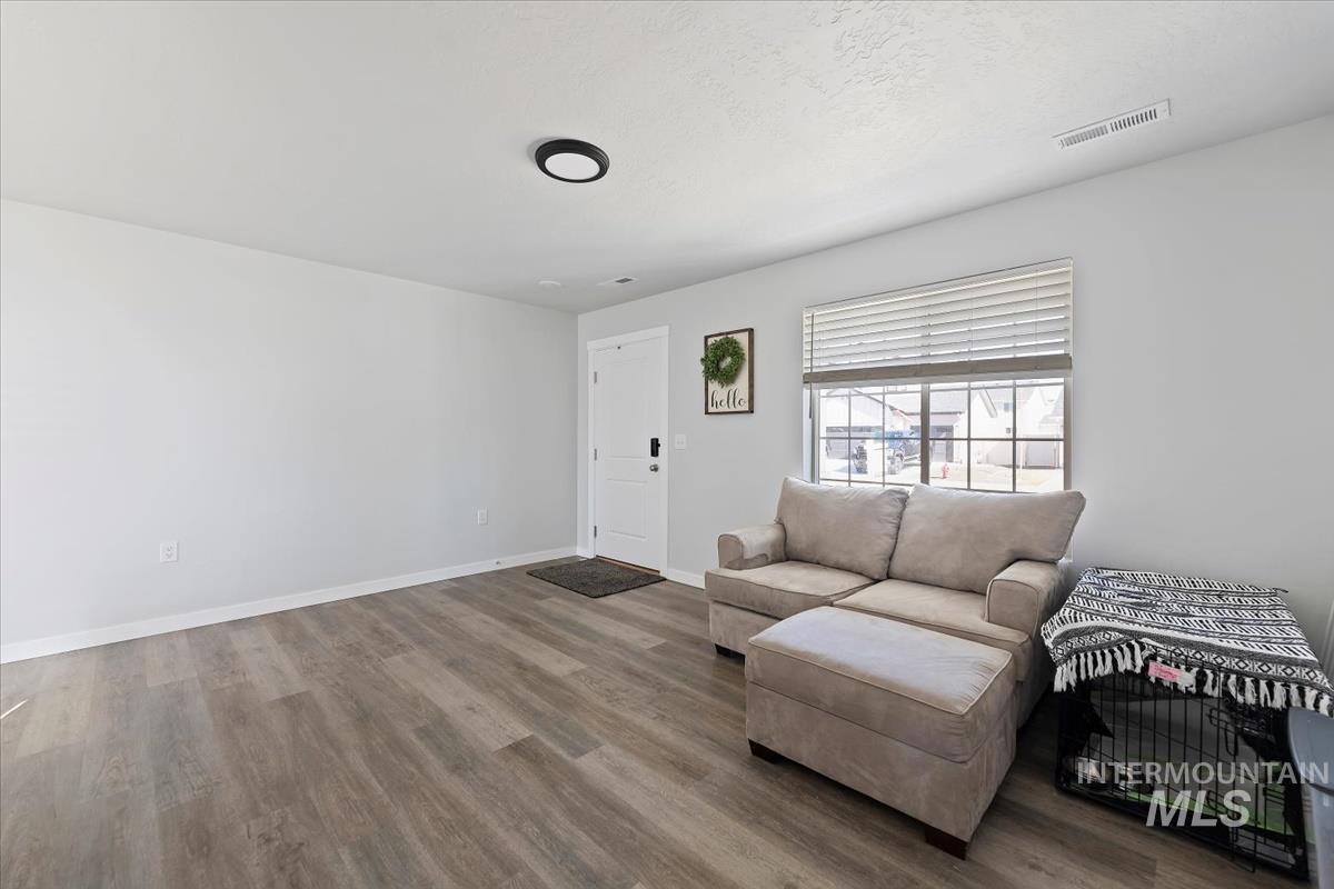 Living room featuring wood finished floors and baseboards