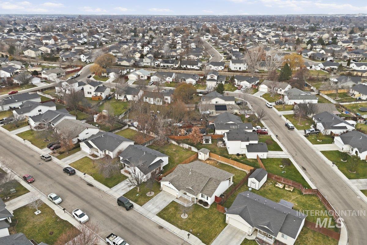 Aerial overview of property's location featuring nearby suburban area