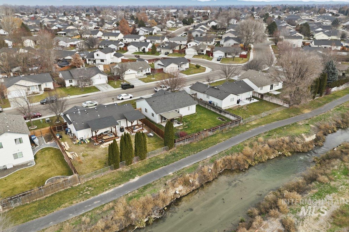 View of property location with nearby suburban area