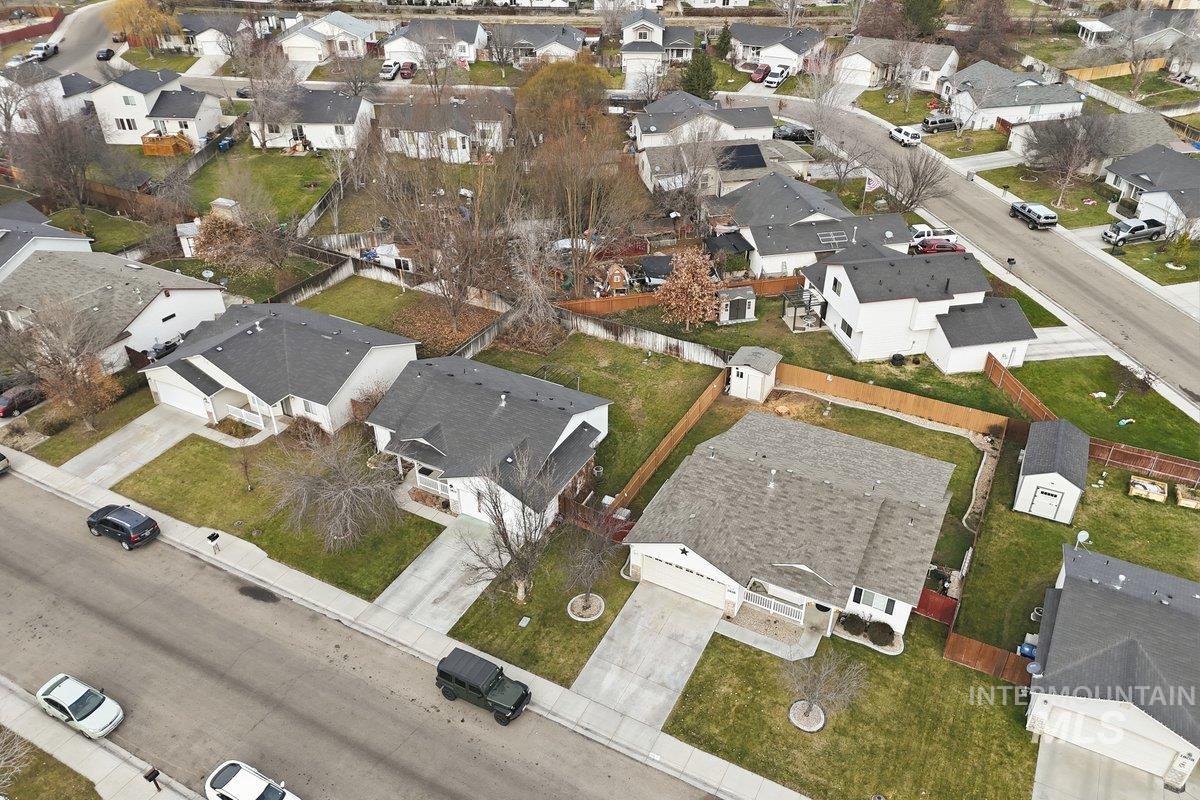 Aerial view of property's location featuring nearby suburban area