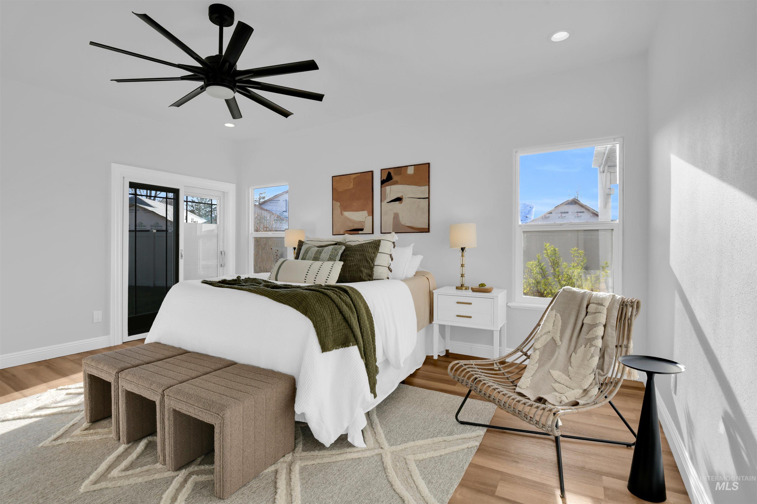 Bedroom featuring ceiling fan, wood finished floors, and recessed lighting
