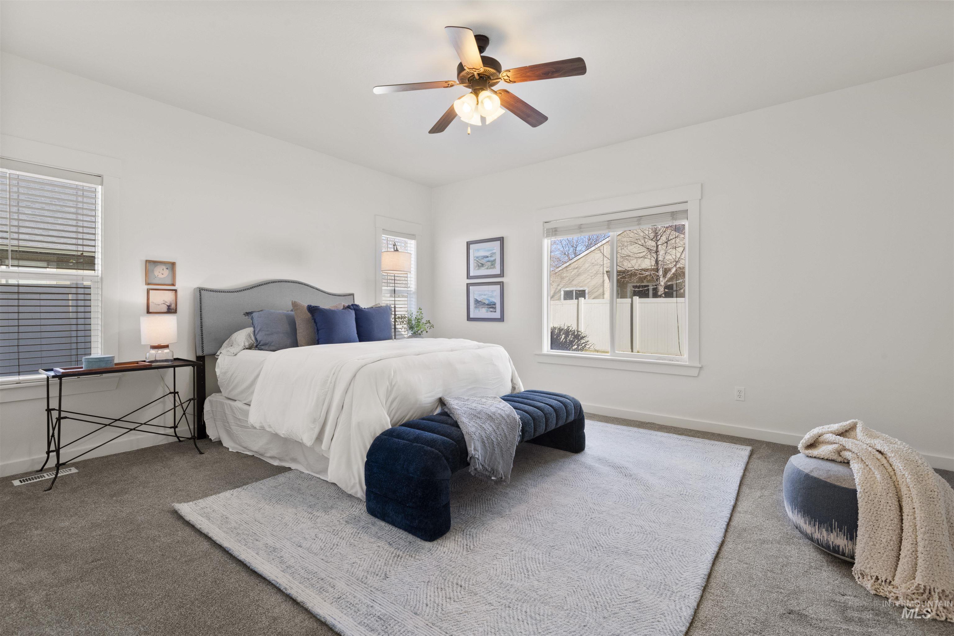 Bedroom with carpet flooring and a ceiling fan