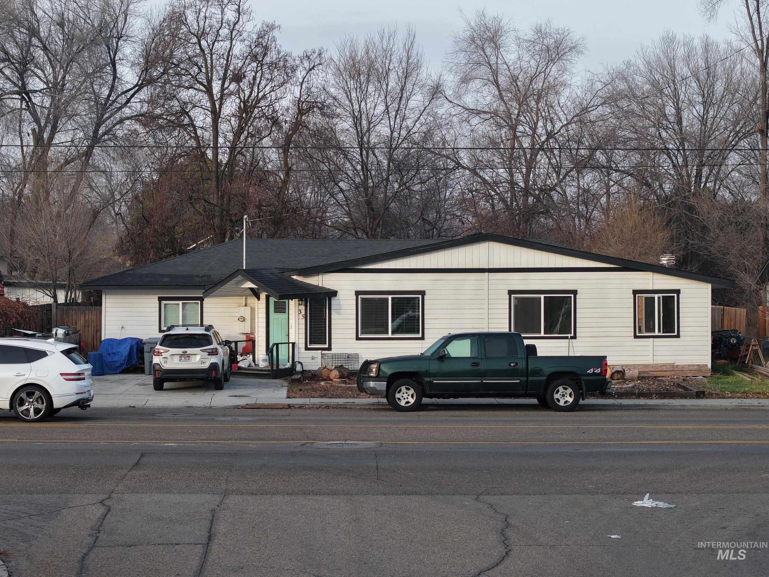 View of front facade with view of wooded area