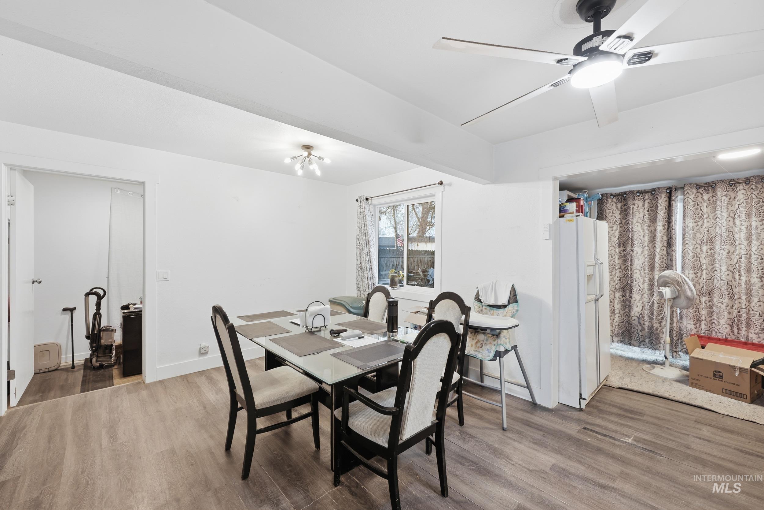 Dining space featuring wood finished floors and ceiling fan