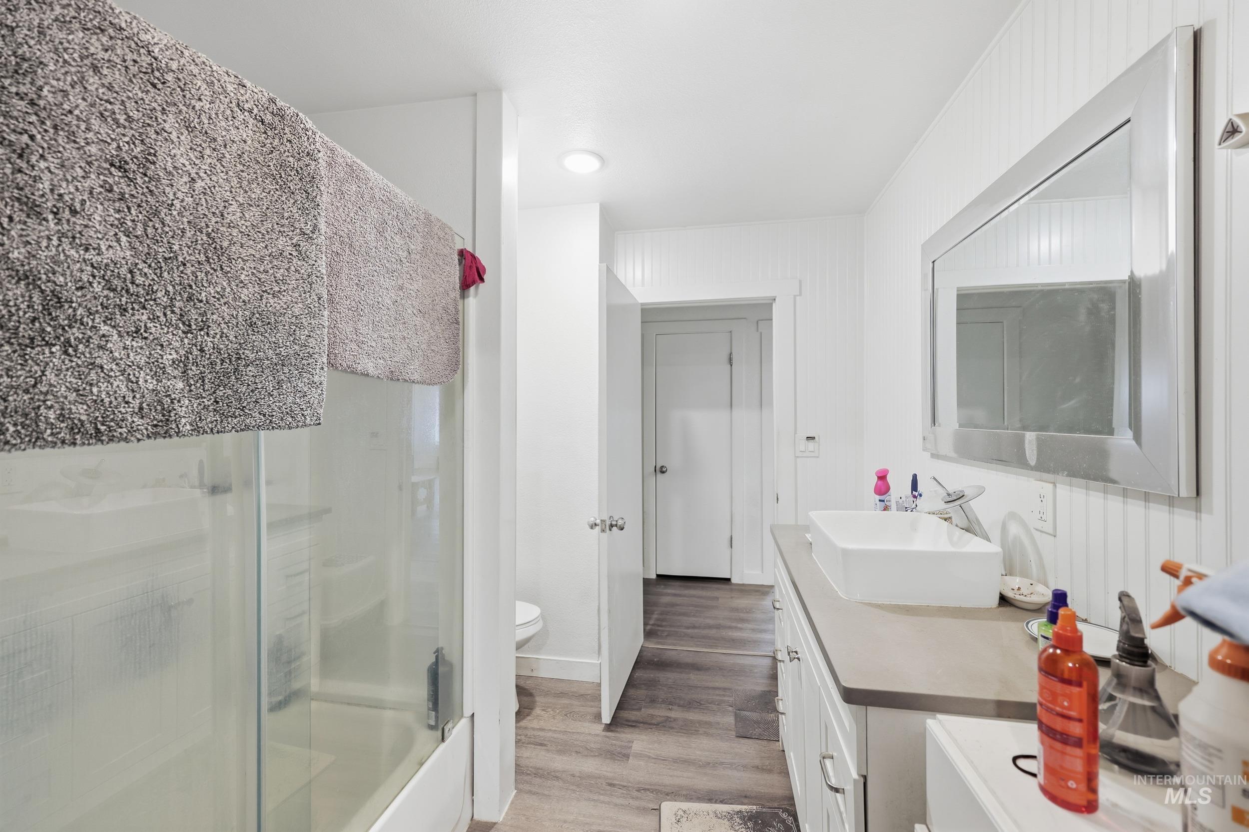 Bathroom featuring vanity and light wood-type flooring