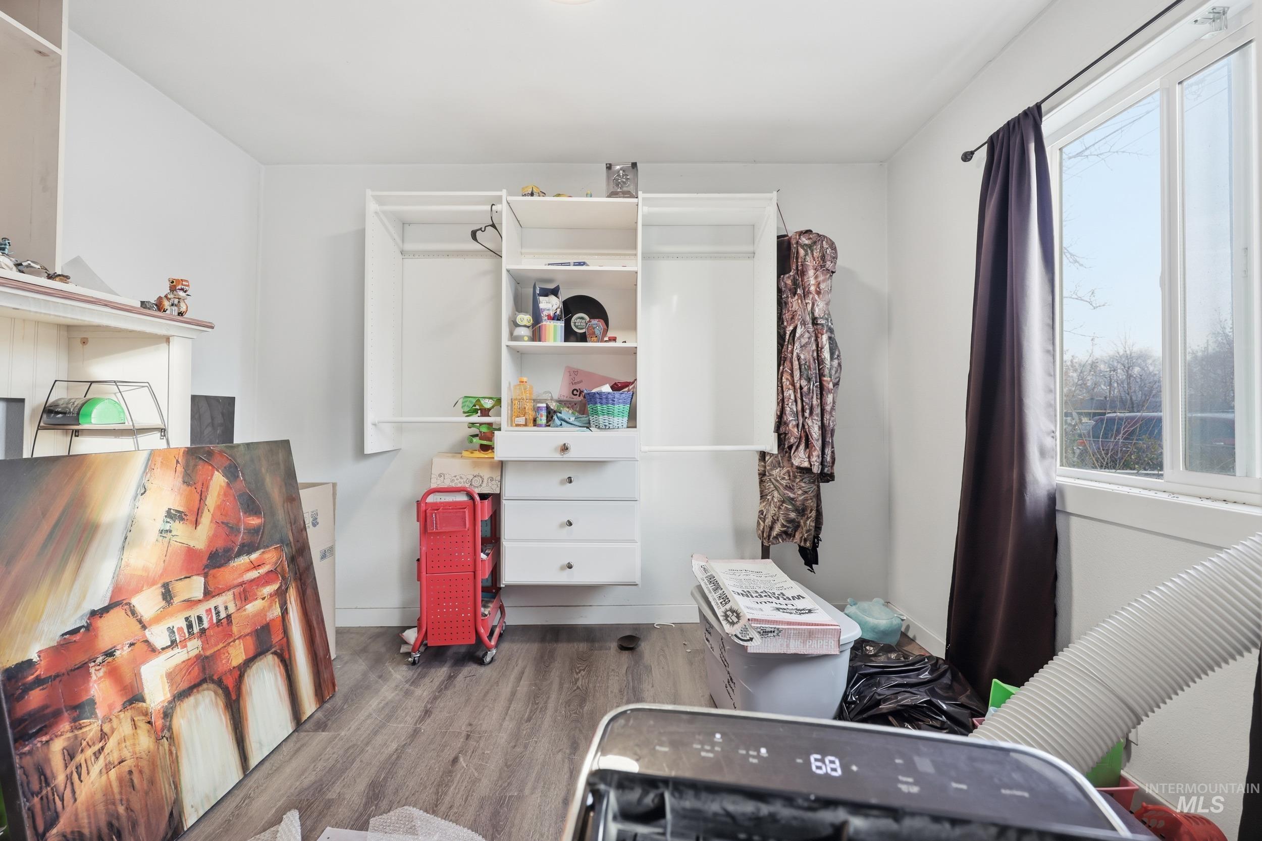 Bedroom featuring dark wood-style floors