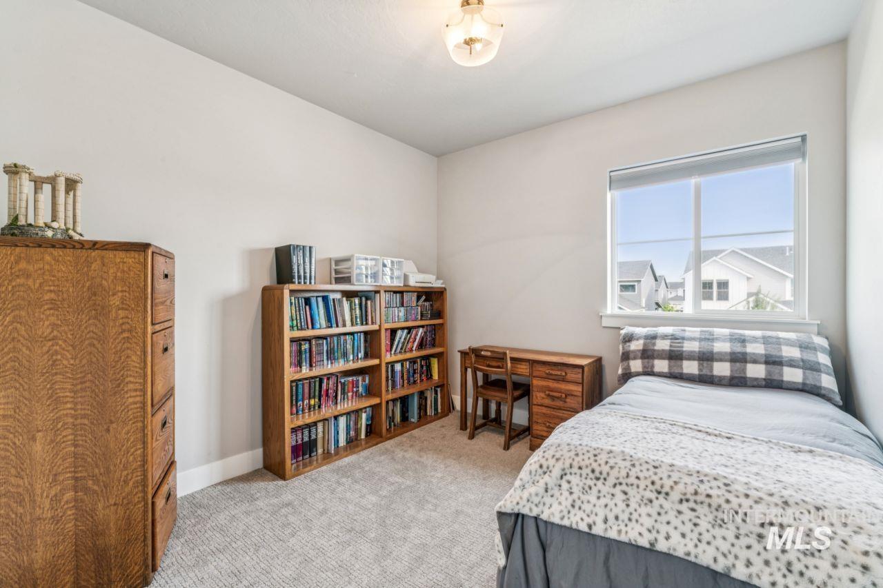 Bedroom with light carpet