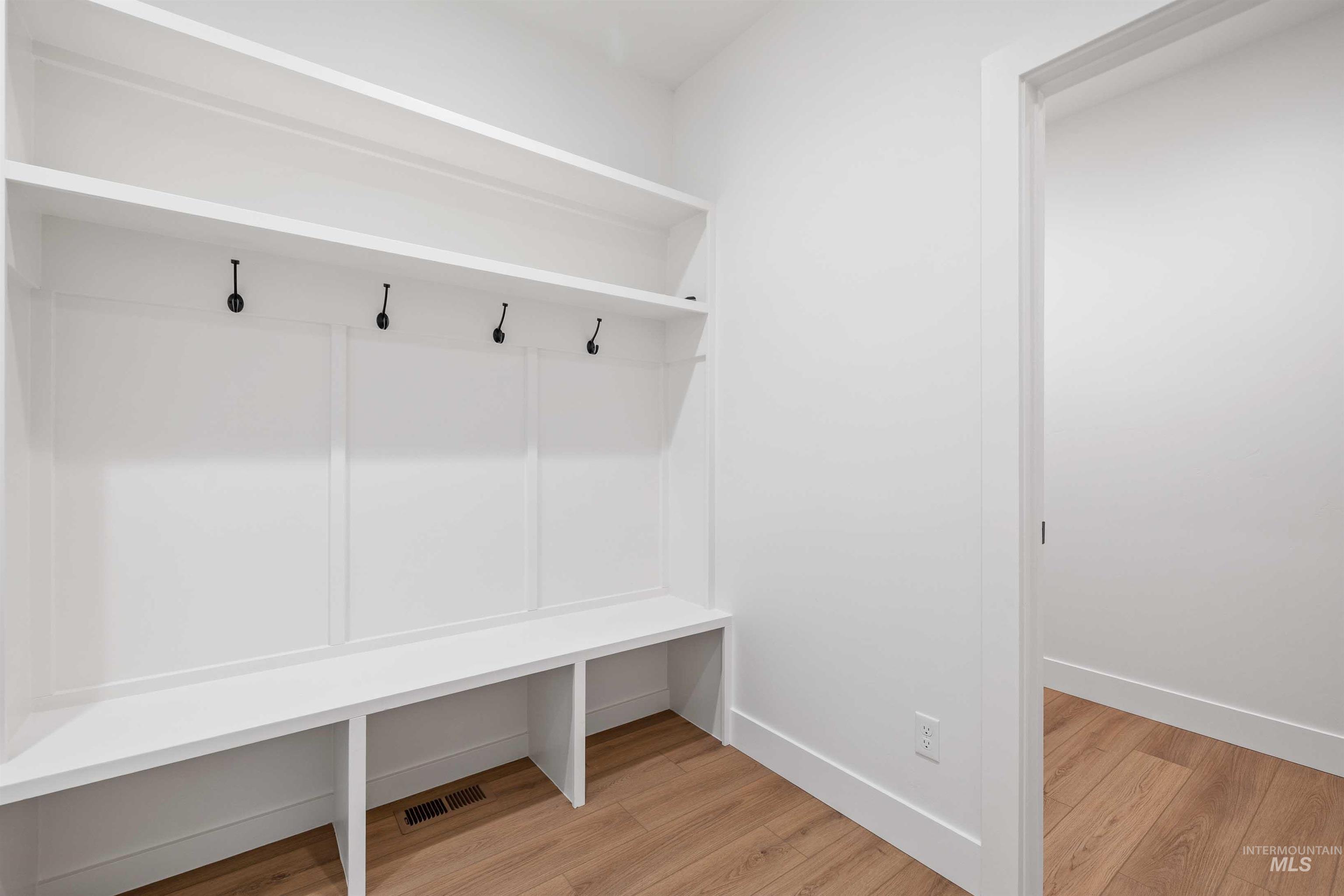 Mudroom with light wood finished floors