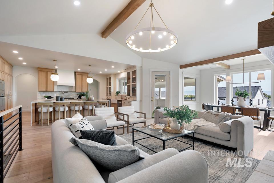 Living room with a chandelier, recessed lighting, and light wood-type flooring