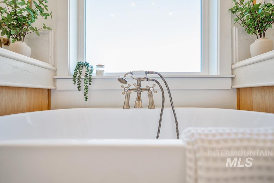 Bathroom view of a freestanding tub and vanity