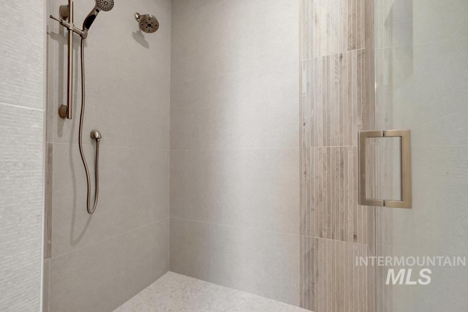 Full bath with a shower stall