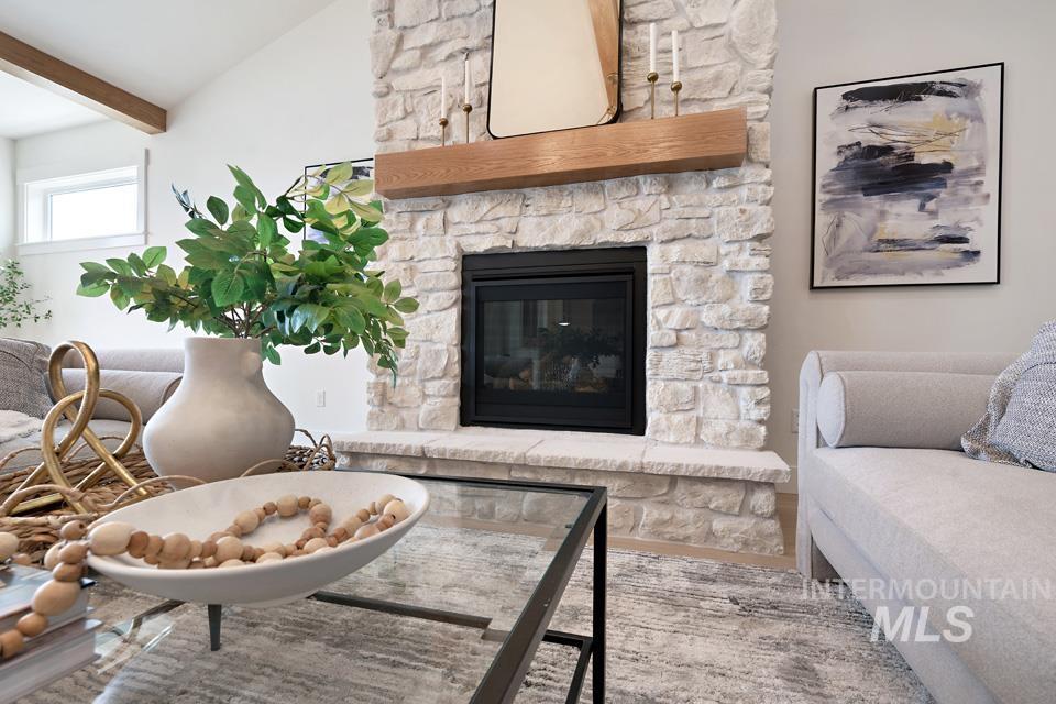 Living area featuring a stone fireplace