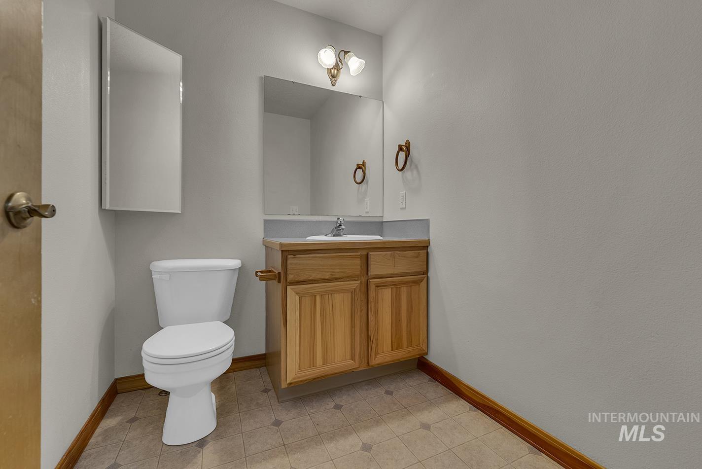 Bathroom featuring vanity and baseboards