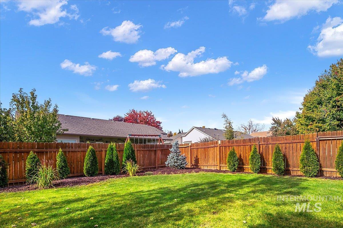 View of fenced backyard