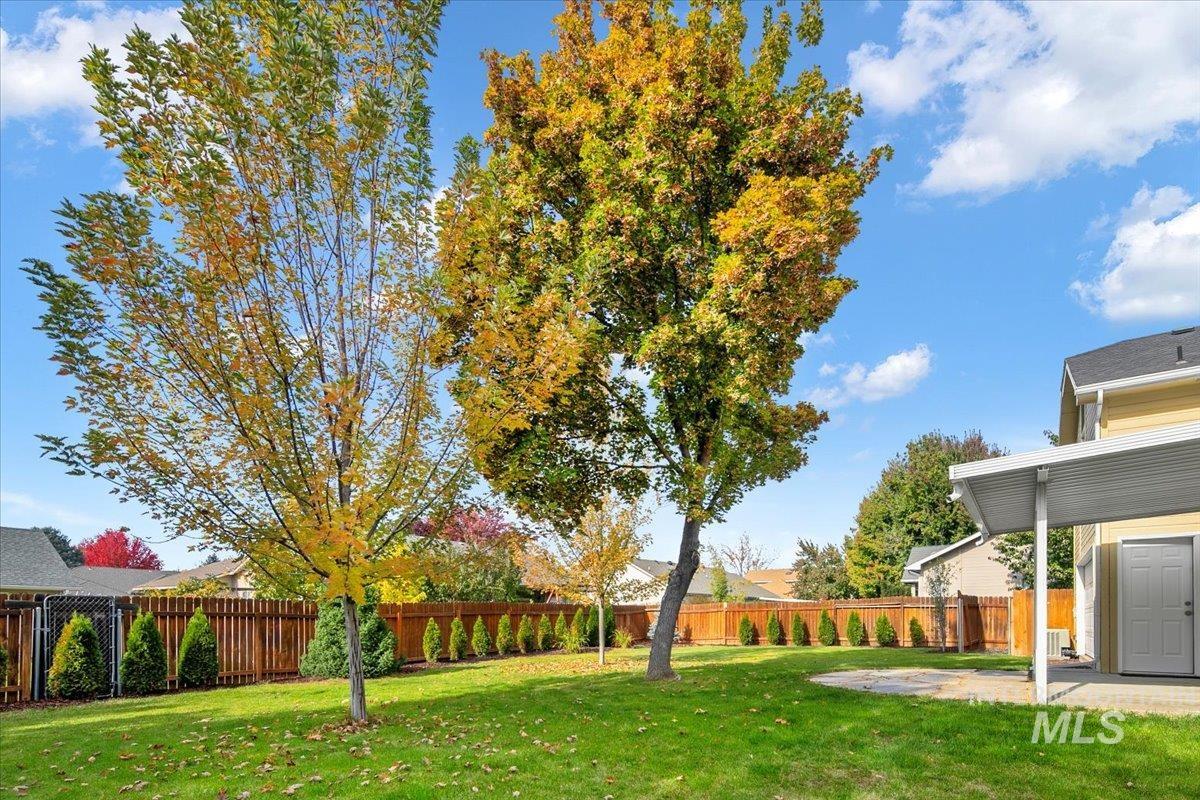 Fenced backyard with a patio area