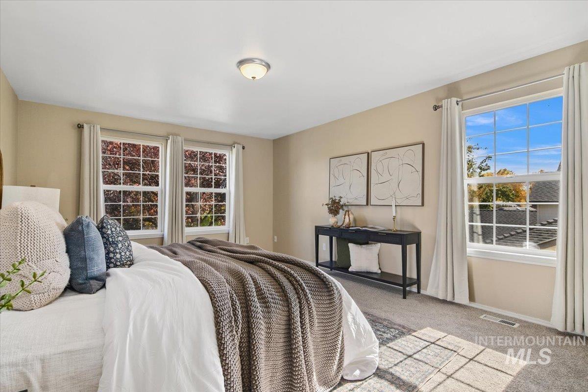 Carpeted bedroom with baseboards