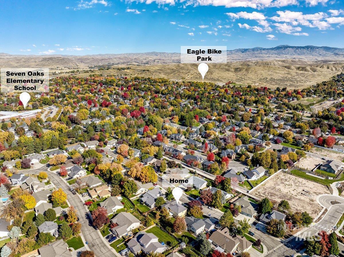 Aerial view of residential area featuring mountains