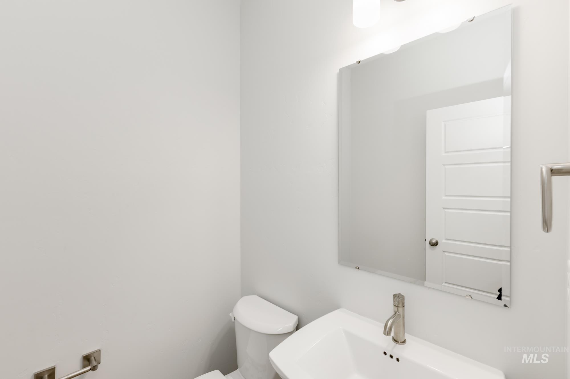 Bathroom featuring toilet and a sink