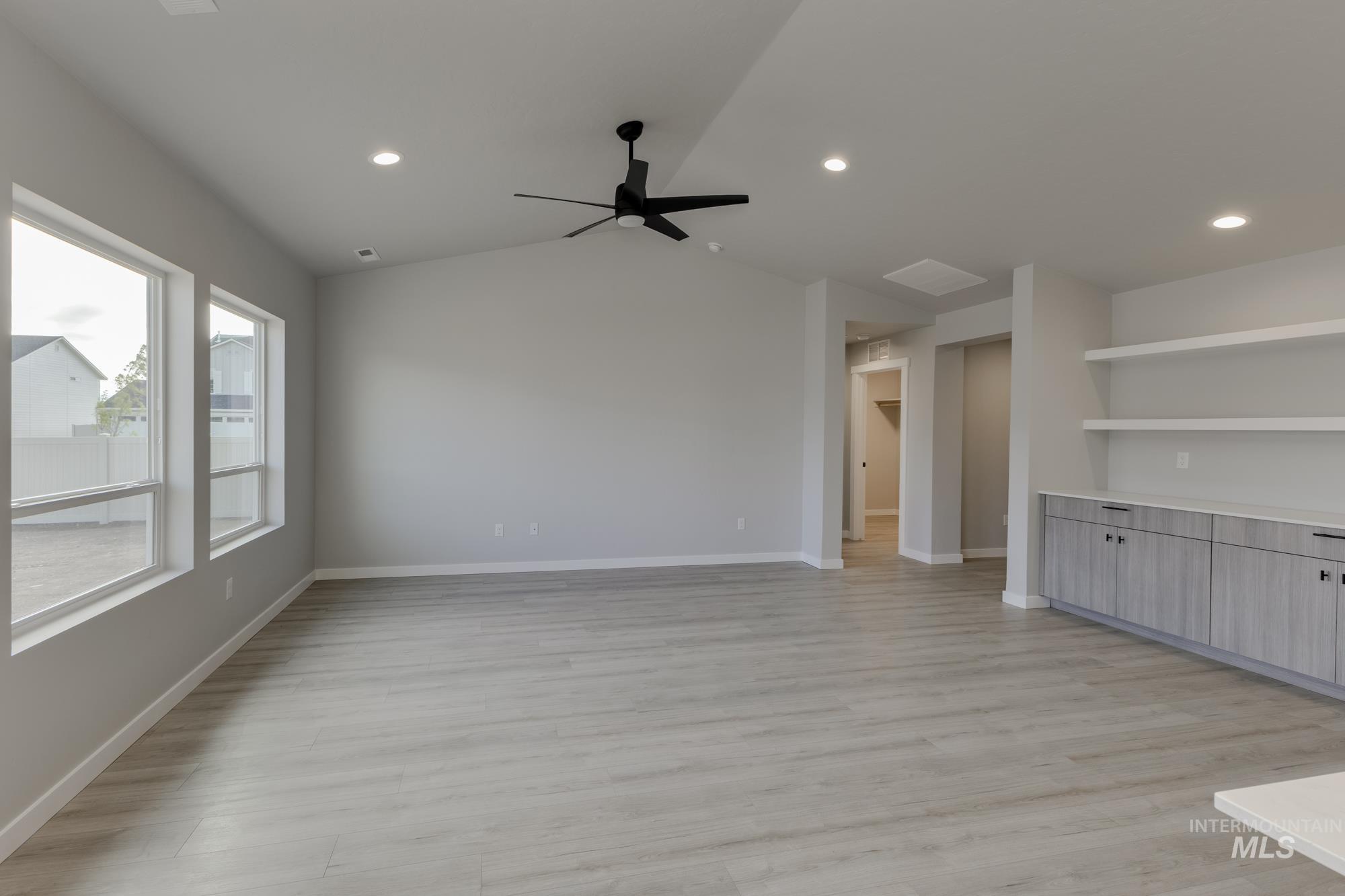 Unfurnished living room featuring light wood-style floors, recessed lighting, and ceiling fan