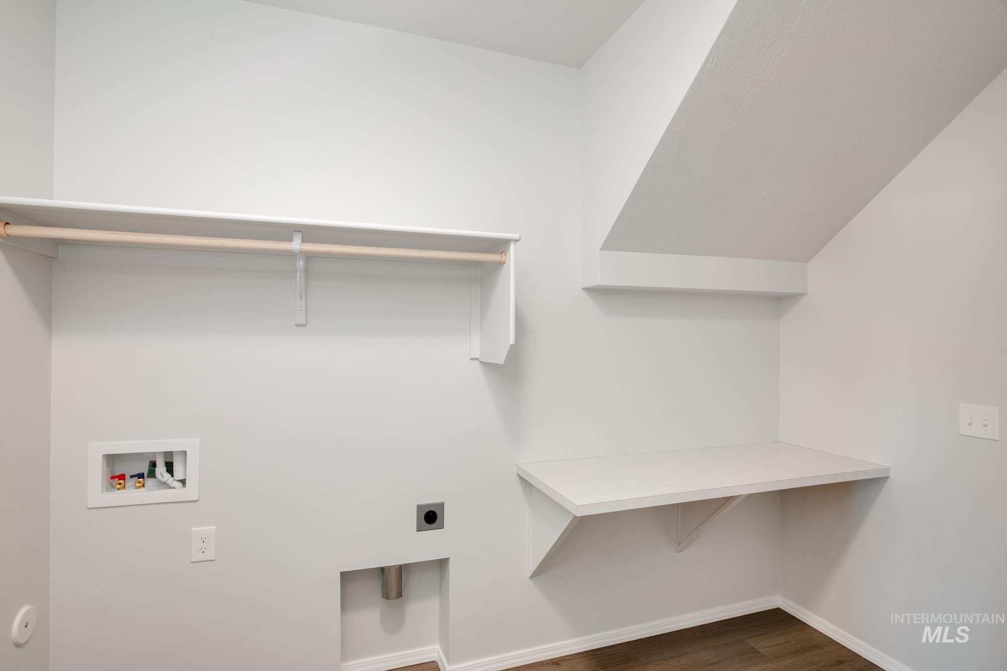 Laundry room featuring dark wood-style floors, electric dryer hookup, and washer hookup