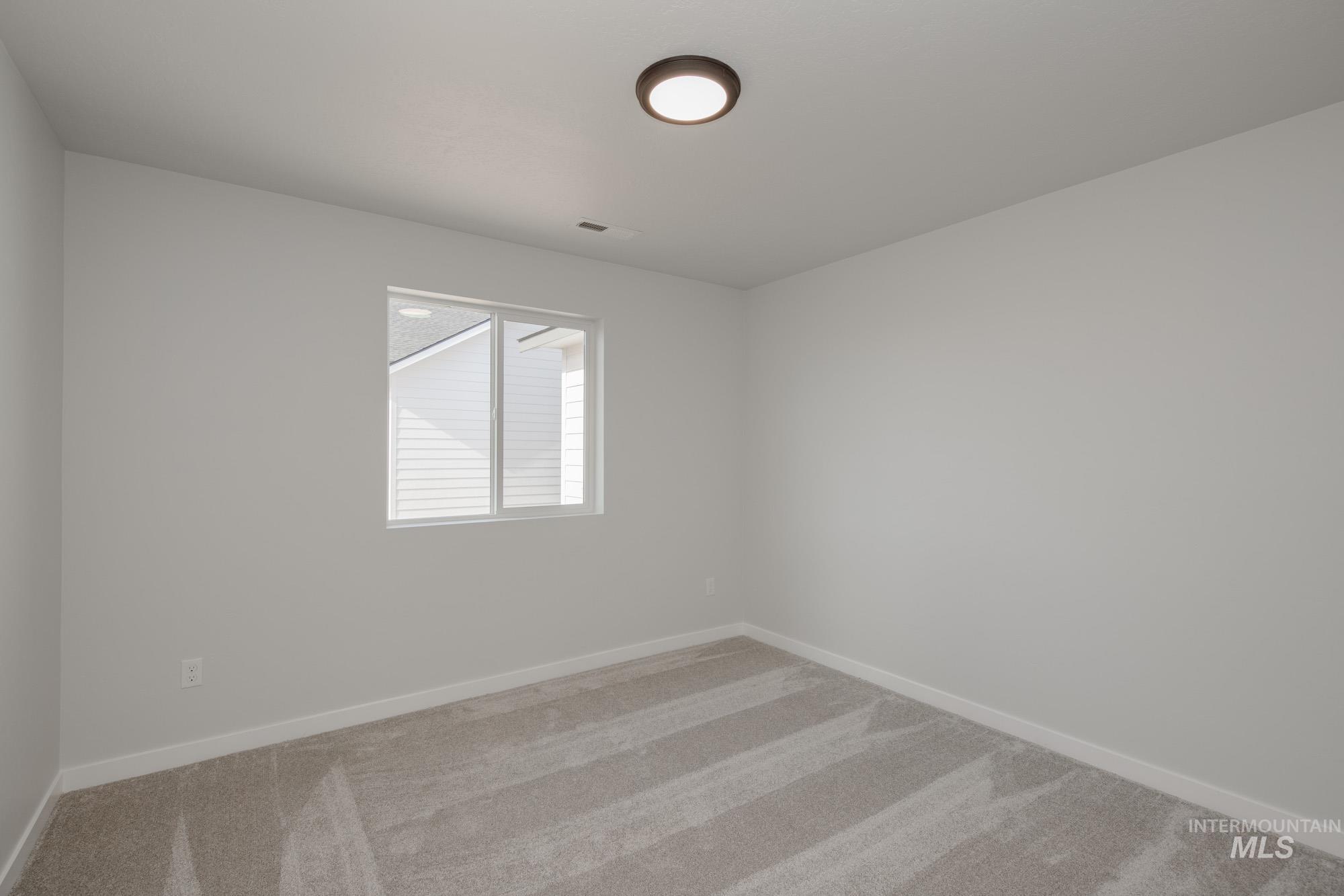 Unfurnished room featuring carpet