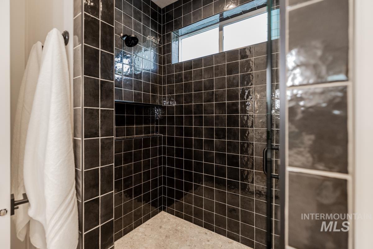 Bathroom featuring tiled shower