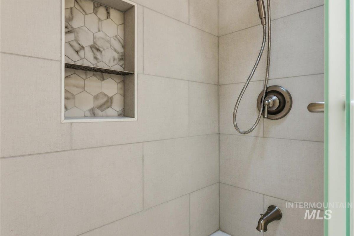 Bathroom view of tiled shower