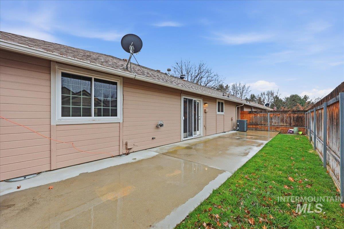 Back of property with a patio and a fenced backyard