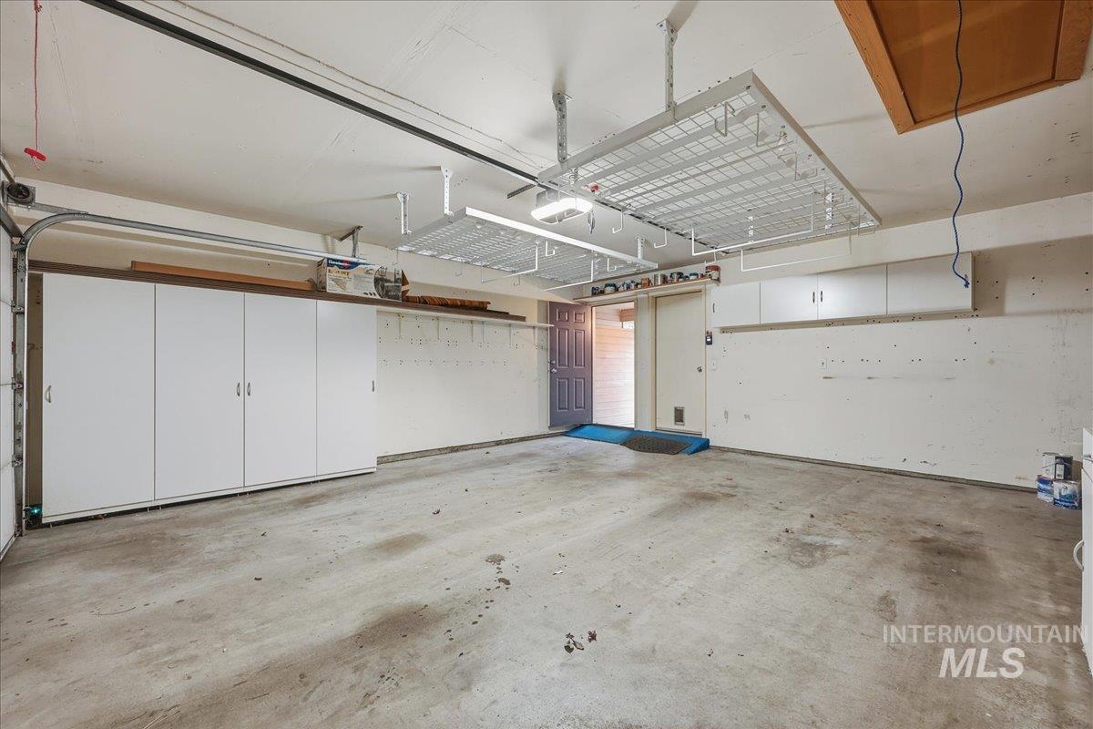 Garage featuring a garage door opener