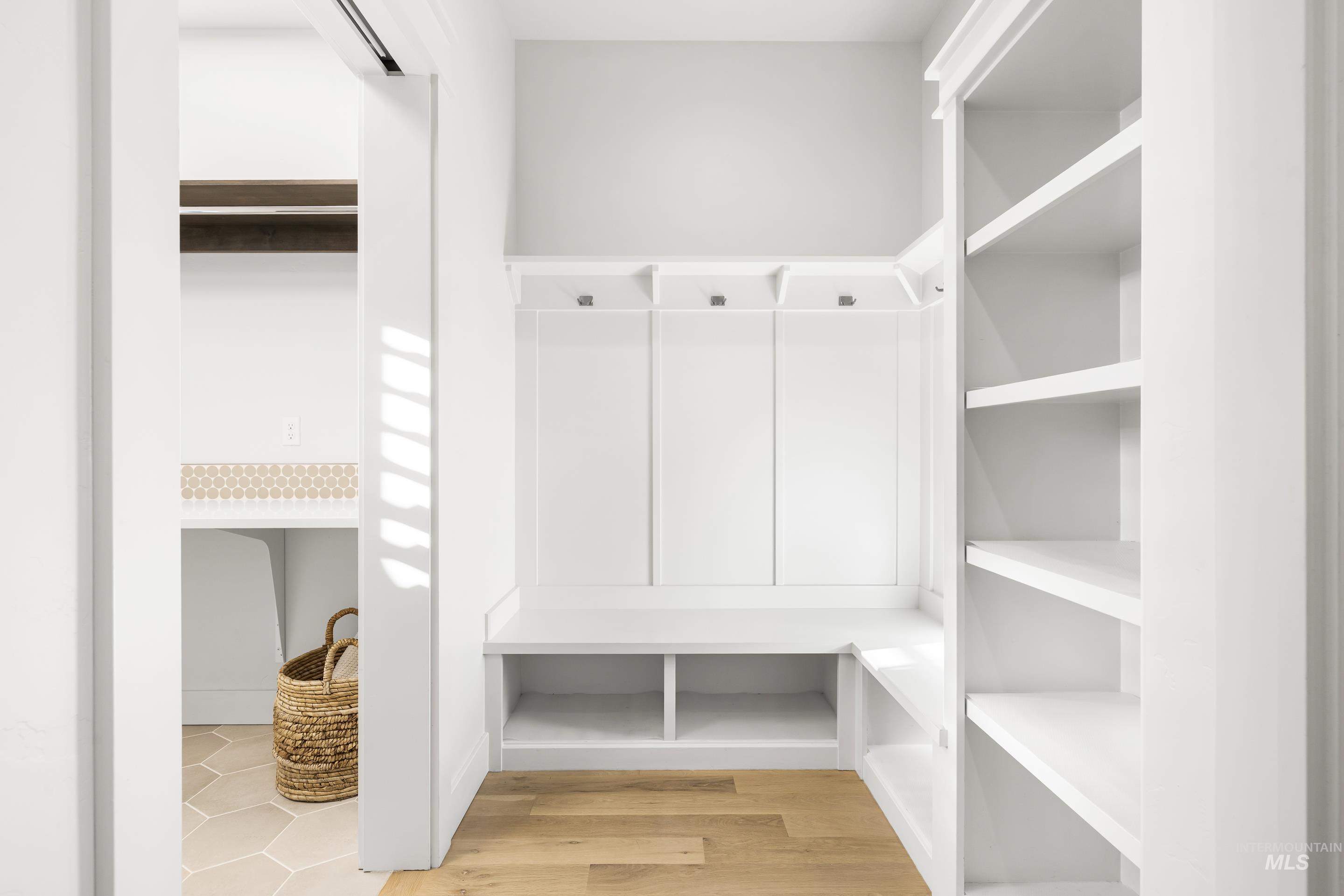 Mudroom with light wood finished floors