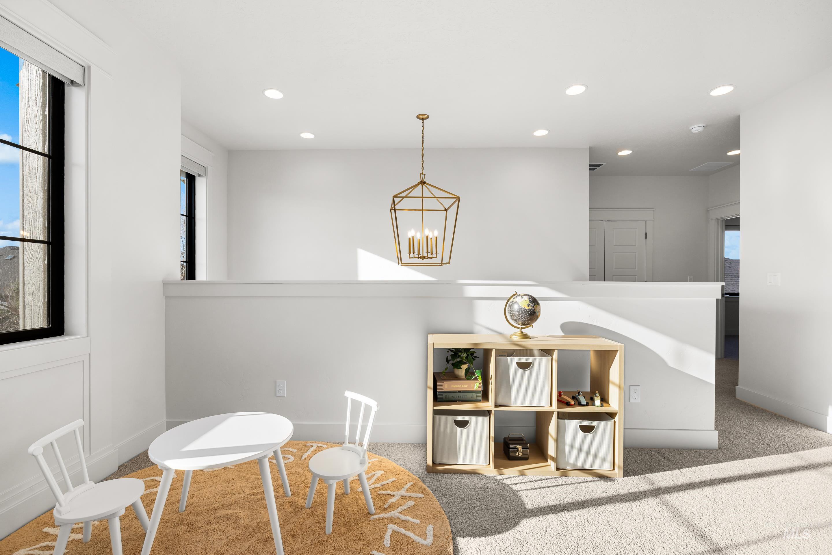 Playroom featuring a chandelier, recessed lighting, and carpet