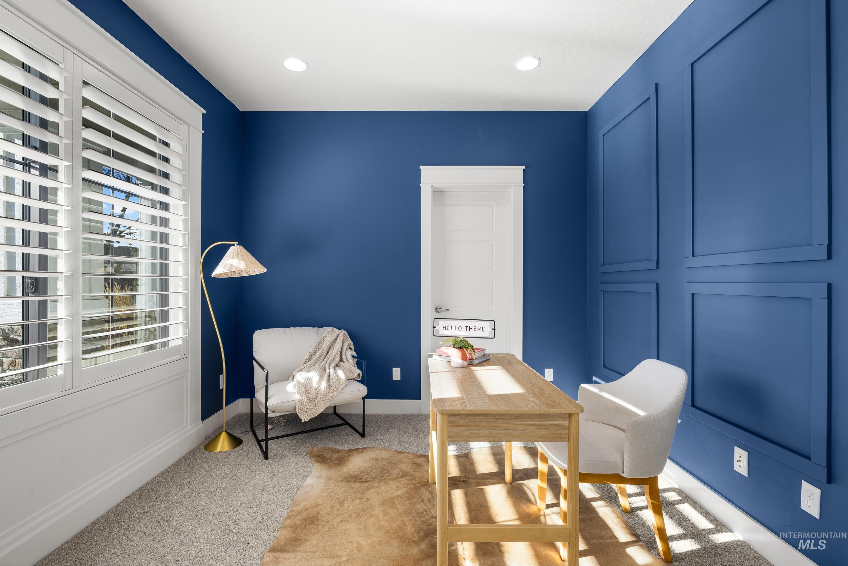 Carpeted office space featuring recessed lighting