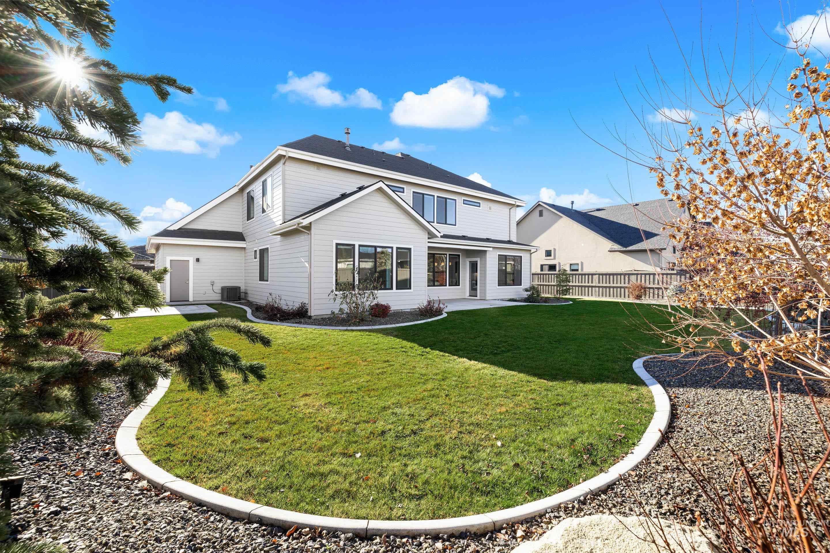 Back of house with a patio area
