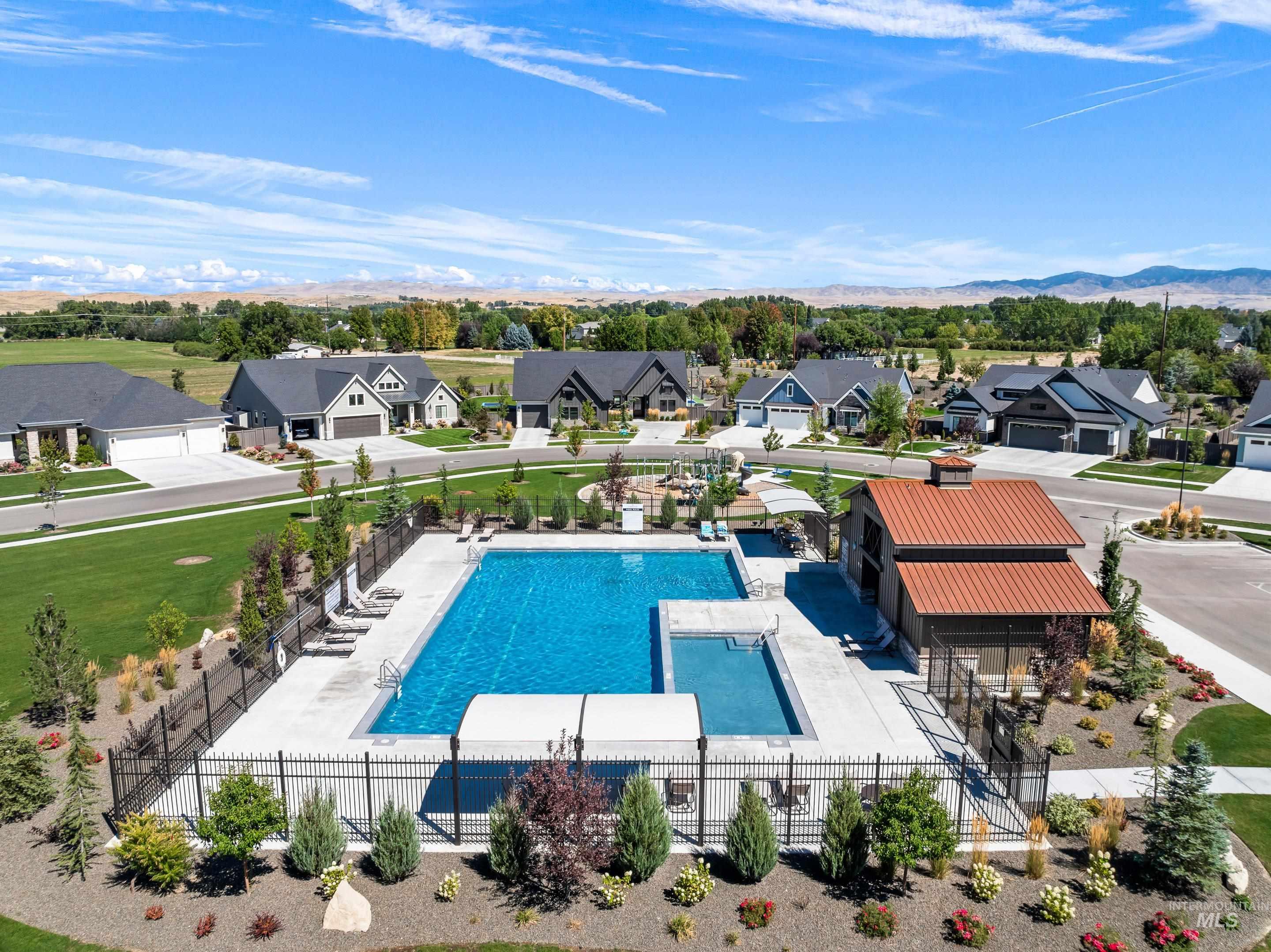 Community pool featuring a residential view and a patio